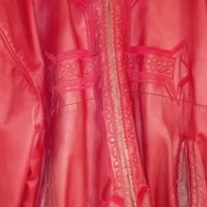 Ladies Red Leather coat. Hooded and lined.Crosses embroidered on front,back,arms